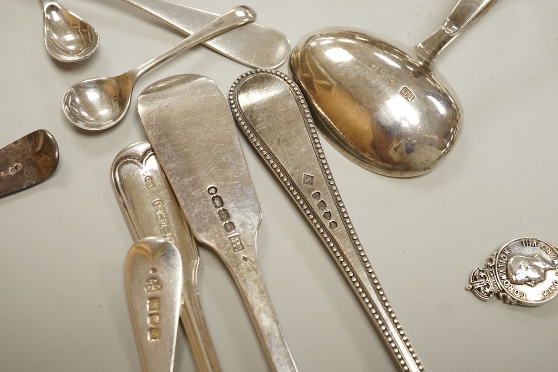 A small collection of assorted mainly 19th century silver flatware, including teaspoons, dessert forks, condiment spoons, serving spoon, etc. various dates and makers, 21.6oz.